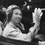 Princess Anne waves on the way back to Buckingham palace from the Guildhall, 7th June 1977. A service was held in St Paul's Cathedral followed by a luncheon at the Guildhall to celebrate the Queen's Silver Jubilee.