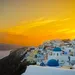 Foto van zondsondergang over Oia, Santorini.