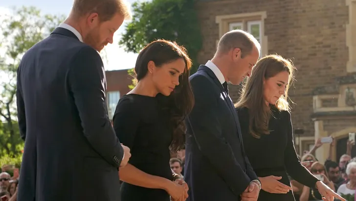 The Prince and Princess of Wales and the Duke and Duchess of Sussex viewing the messages and floral tributes