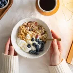 Top view book and Christmas healthy lifestyle breakfast with granola muesli and yogurt