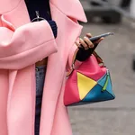 Paris, France - October, 3, 2022: woman wears Loewe multicolor small puzzle bag, street style