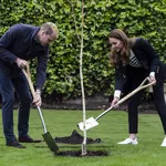 Britain's Catherine, Duchess of Cambridge and Britain's Prince William, Duke of Cambridge, take part in a tree planting ceremony as they visit the University of St Andrews in St Andrews on May 26, 2021.