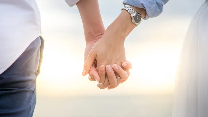 Couple holding thier hands wedding concept