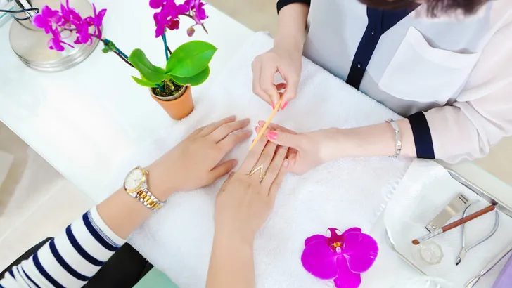 Manicurists and Pedicurists Serving Customers in Nail Spa Salon