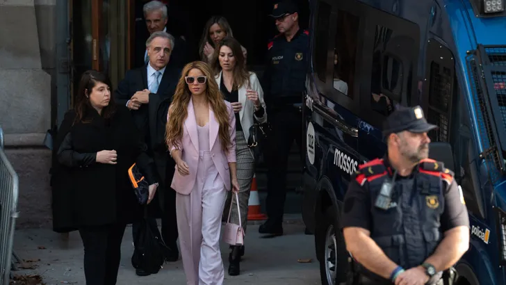 Shakira (2nd L) leaves the High Court of Justice of Catalonia