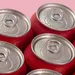 Blikjes drinken op roze achtergrond - Wibra