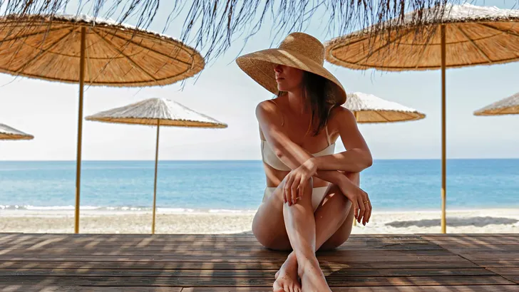 Close up shot of a caucasian woman with fit body wearing white b