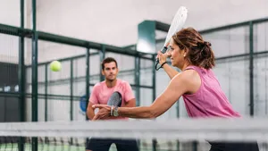 mixed padel match in a padel court indoor