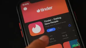 The Tinder application on the Iphone 11 Pro screen. Tinder is a location-based dating and social discovery service application.