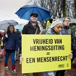 Demonstranten tijdens een protest van Amnesty International