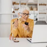 Senior woman working from home