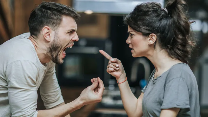 Furious couple arguing while having problems in their relationship.