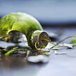 Green, broken glass Christmas ornament 