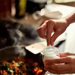 Young woman cooking in the kitchen