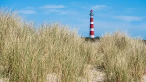 View on lighthouse in the dunes of Ameland, Holland