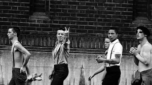 Skinheads walk by giving the Two Fingered Salute