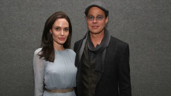 Angelina Jolie is geflirt Brad Pitt beu en zet 'm op straat