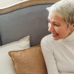 Cheerful Caucasian short-haired elderly lady looking away