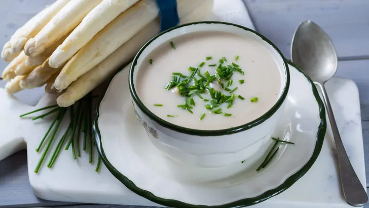 Spring season - white  asparagus soup with fresh green chives re