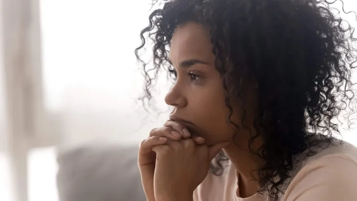 Close up of pensive black woman thinking having life troubles