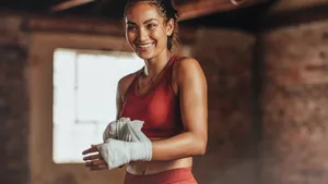 Woman getting ready for boxing practice