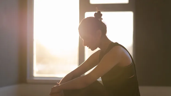 Relaxing woman in a yoga studio