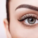 Female eye with long false eyelashes