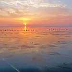 Sunset at the Wadden Sea in the Netherlands