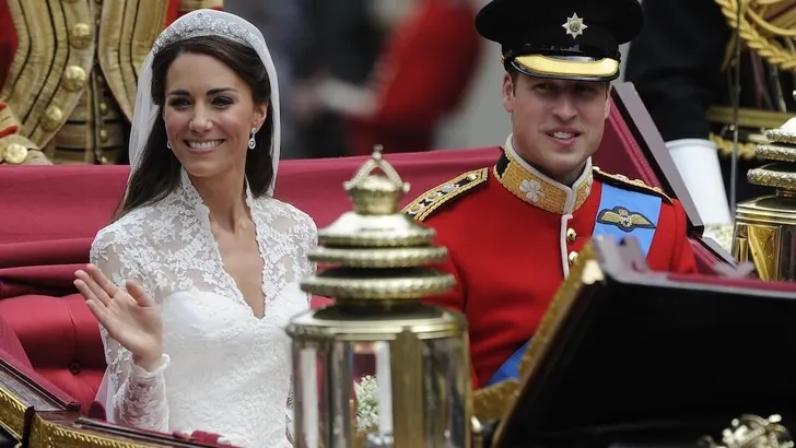 Britain's Prince William and Catherine Duchess of Cambridge travel to Buckingham Palace along Procession Route after their wedding in Westminster Abbey in London