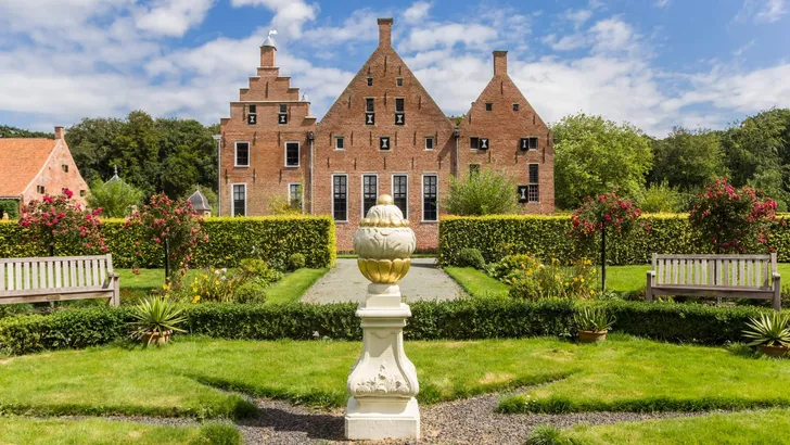 Garden and historic building of the Menkemaborg in Groningen