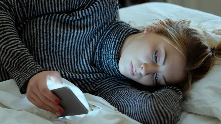 Teenage Girl Victim Of Bullying reading Text Message