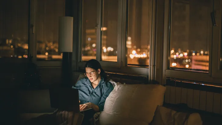 Woman using laptop at home