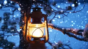 Christmas lantern in magic winter evening snowy forest hanging on snow covered tree. Beautiful winter natural background with kerosene lamp. New year and Christmas Holiday concept.