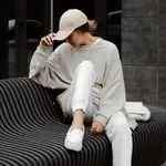 Beautiful,Blonde,Girl,Dressed,In,Beige,Oversized,Sweatshirt,,White,Sweatpants,