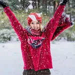 Winter young woman portrait. Beauty Joyful Model Girl laughing and having fun in winter park.