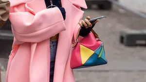 Paris, France - October, 3, 2022: woman wears Loewe multicolor small puzzle bag, street style