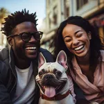 A multicultural couple shares a laughter-filled moment with their playful French Bulldog on a vibrant city rooftop, illustrating the happiness found in urban living with canine com