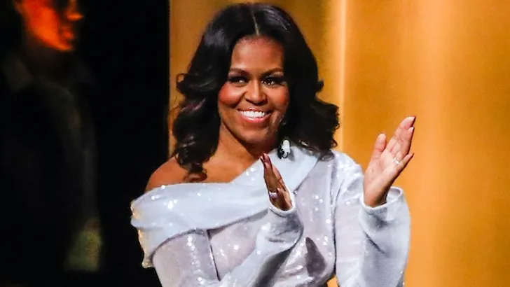 De reden waarom Michelle Obama die duizelingwekkende glitterlaarzen tot aan d'r dij droeg 