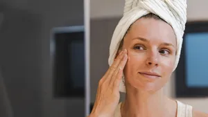 Woman Applying Moisturizing Face Cream