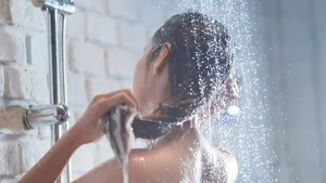 Asian woman Enjoying the shower She is washing her hair.