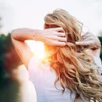 Blond girl standing at the bridge