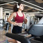 Pretty latin young woman going on a run at the gym