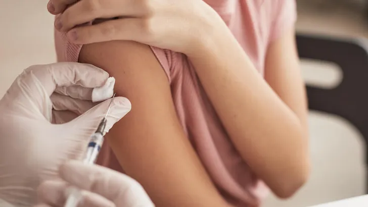 Doctor Vaccinating Little Girl Close Up