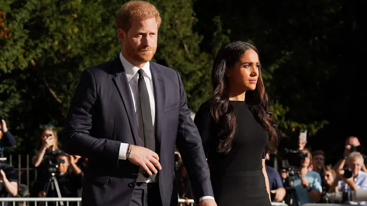 The Prince and Princess of Wales and the Duke and Duchess of Sussex viewing the messages and floral tributes