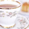 Koningin Elizabeth brengt thee naar klusjesman