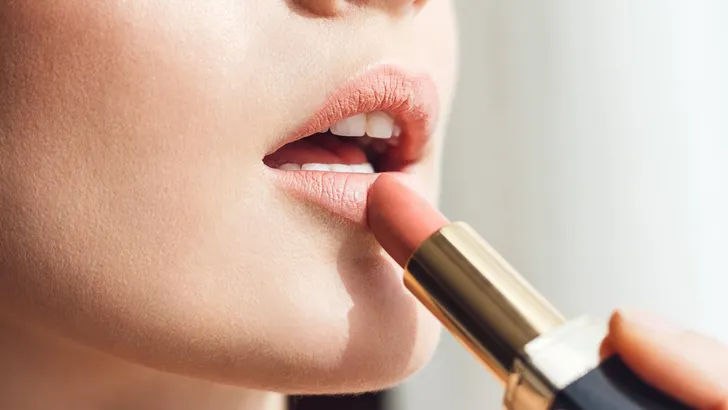 Beauty photo of applying lipstick
