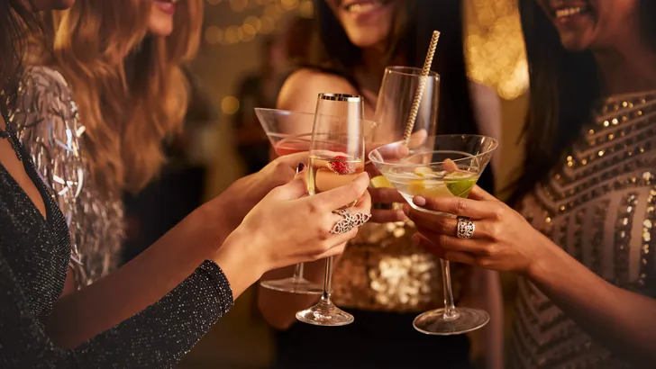 Female Friends Make Toast As They Celebrate At Party