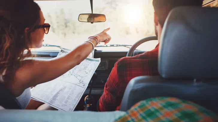 Couple on a road trip taking detour