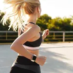 Image of attractive fitness woman wearing tracksuit running outd