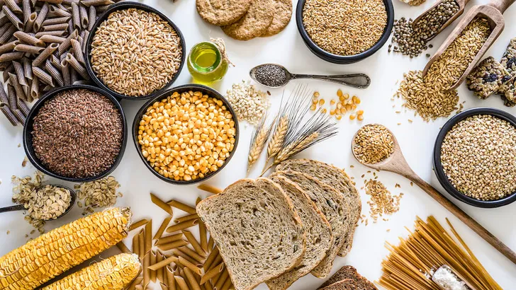 Dietary fiber: large group of wholegrain food shot from above on white background